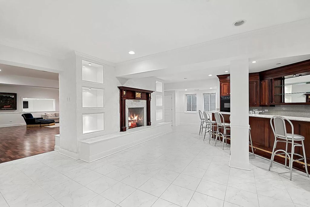 The Estate in Oak Brook is a luxurious home surrounded by beautifully manicured professionally landscaped gardens now available for sale. This home located at 704 Deer Trail Ln, Oak Brook, Illinois; offering 08 bedrooms and 10 bathrooms with 16,981 square feet of living spaces.
