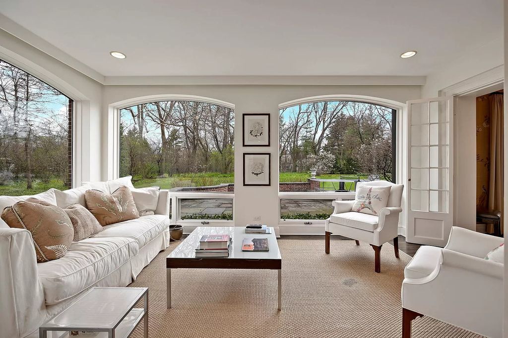 The House in Winnetka offers inviting two-story foyer with curved staircase and marble floors, now available for sale. This home located at 62 Woodley Rd, Winnetka, Illinois
