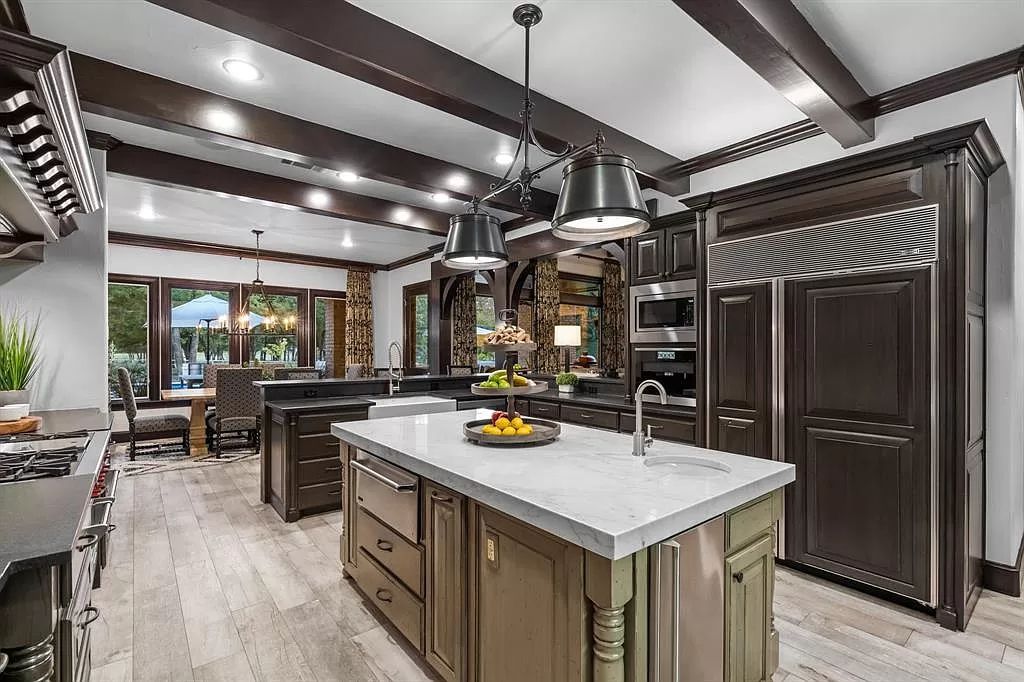 The Estate in Argyle, a stunning home with tranquil setting and a stocked pond offering outdoor oasis with ample covered area with fireplace and both a barbecue and smoker perfect for entertaining is now available for sale. This home located at 1000 Roadrunner Rd, Argyle, Texas