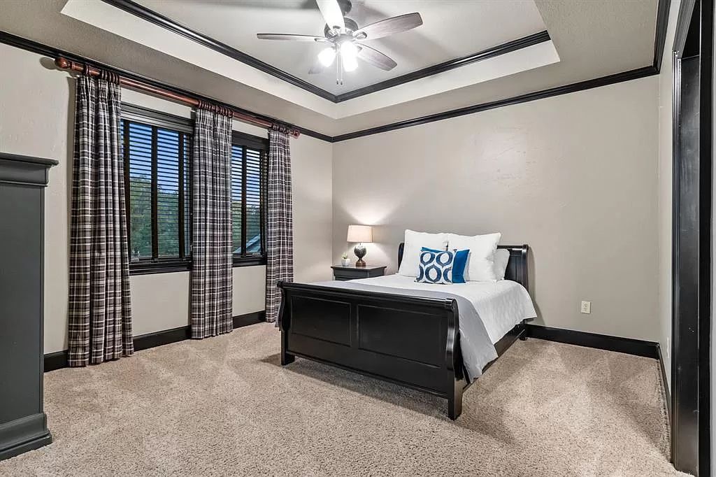 The Estate in Argyle, a stunning home with tranquil setting and a stocked pond offering outdoor oasis with ample covered area with fireplace and both a barbecue and smoker perfect for entertaining is now available for sale. This home located at 1000 Roadrunner Rd, Argyle, Texas