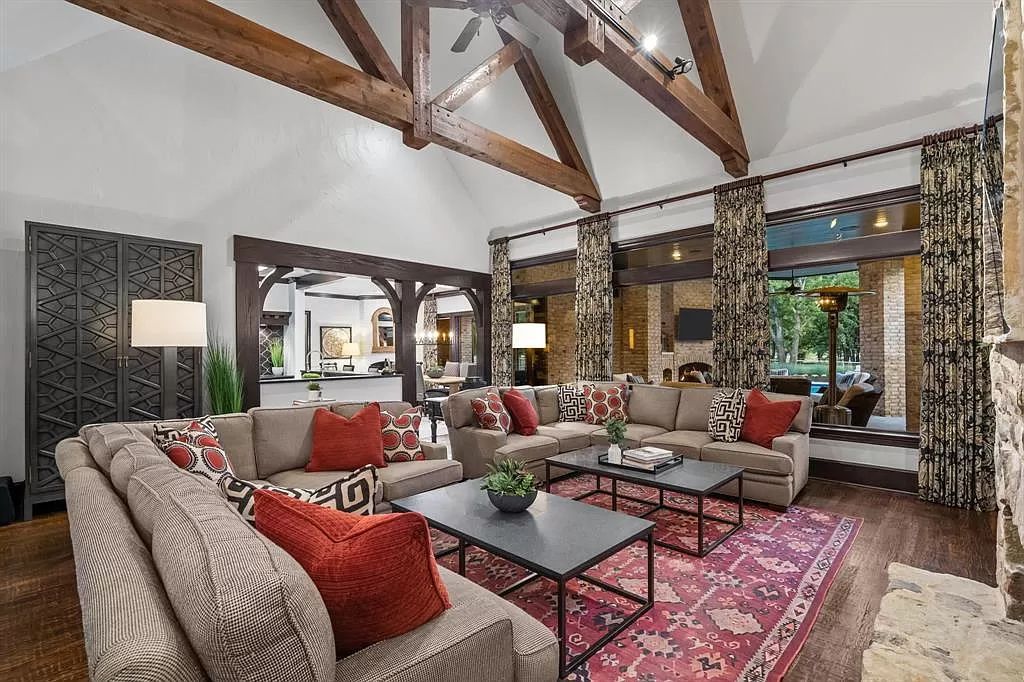 The Estate in Argyle, a stunning home with tranquil setting and a stocked pond offering outdoor oasis with ample covered area with fireplace and both a barbecue and smoker perfect for entertaining is now available for sale. This home located at 1000 Roadrunner Rd, Argyle, Texas