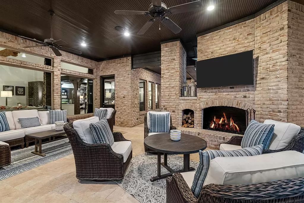 The Estate in Argyle, a stunning home with tranquil setting and a stocked pond offering outdoor oasis with ample covered area with fireplace and both a barbecue and smoker perfect for entertaining is now available for sale. This home located at 1000 Roadrunner Rd, Argyle, Texas