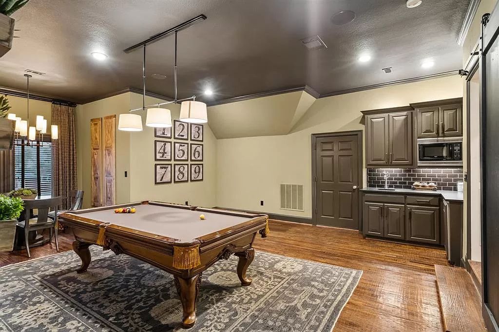 The Estate in Argyle, a stunning home with tranquil setting and a stocked pond offering outdoor oasis with ample covered area with fireplace and both a barbecue and smoker perfect for entertaining is now available for sale. This home located at 1000 Roadrunner Rd, Argyle, Texas