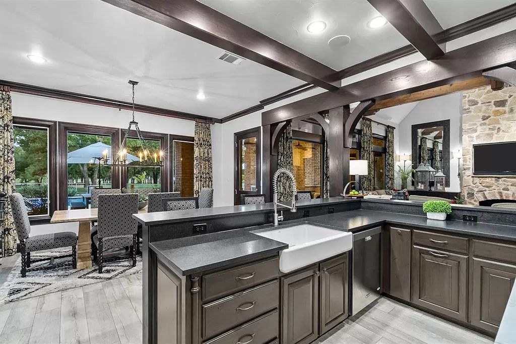 The Estate in Argyle, a stunning home with tranquil setting and a stocked pond offering outdoor oasis with ample covered area with fireplace and both a barbecue and smoker perfect for entertaining is now available for sale. This home located at 1000 Roadrunner Rd, Argyle, Texas