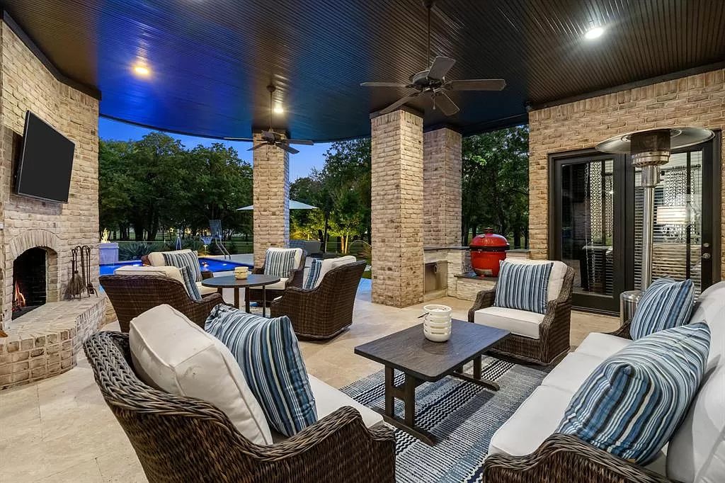The Estate in Argyle, a stunning home with tranquil setting and a stocked pond offering outdoor oasis with ample covered area with fireplace and both a barbecue and smoker perfect for entertaining is now available for sale. This home located at 1000 Roadrunner Rd, Argyle, Texas