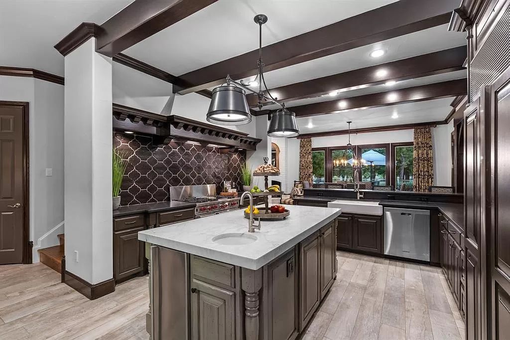 The Estate in Argyle, a stunning home with tranquil setting and a stocked pond offering outdoor oasis with ample covered area with fireplace and both a barbecue and smoker perfect for entertaining is now available for sale. This home located at 1000 Roadrunner Rd, Argyle, Texas