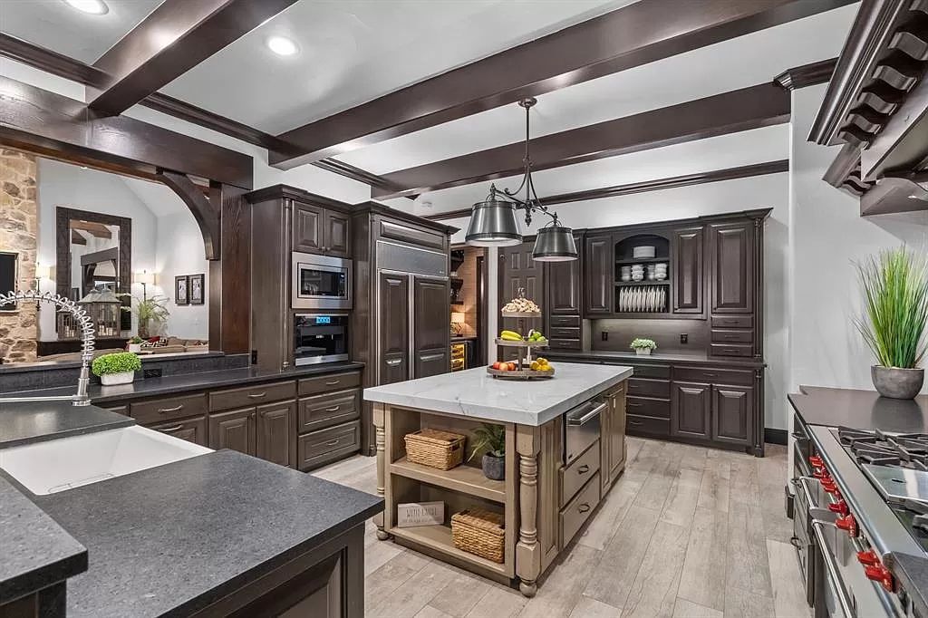 The Estate in Argyle, a stunning home with tranquil setting and a stocked pond offering outdoor oasis with ample covered area with fireplace and both a barbecue and smoker perfect for entertaining is now available for sale. This home located at 1000 Roadrunner Rd, Argyle, Texas