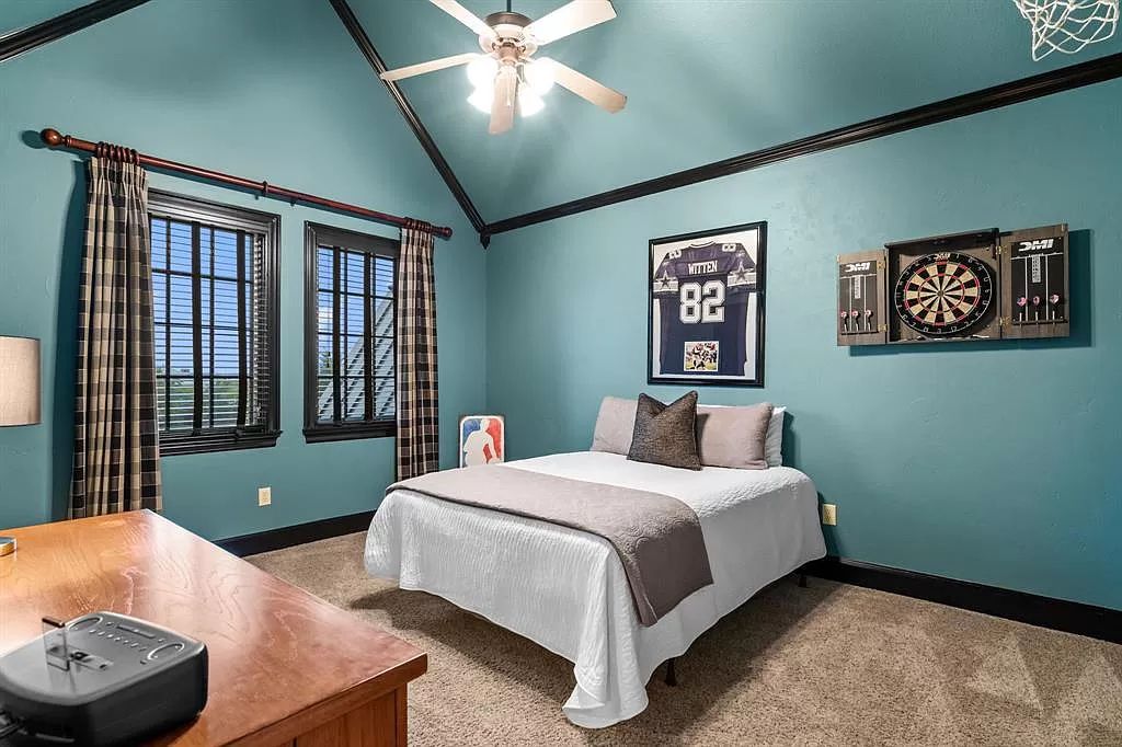 The Estate in Argyle, a stunning home with tranquil setting and a stocked pond offering outdoor oasis with ample covered area with fireplace and both a barbecue and smoker perfect for entertaining is now available for sale. This home located at 1000 Roadrunner Rd, Argyle, Texas