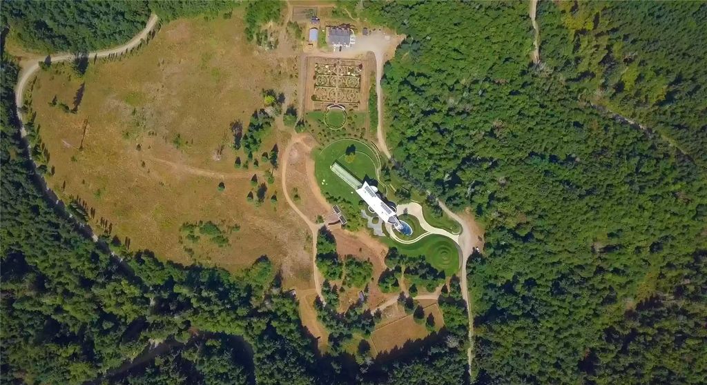 The Home in Tenino  atop 85 acres of stunning land with sustainable gardens, saltwater pool and archery range, now available for sale. This home located at 7415 Nanitch Lane SE, Tenino, Washington