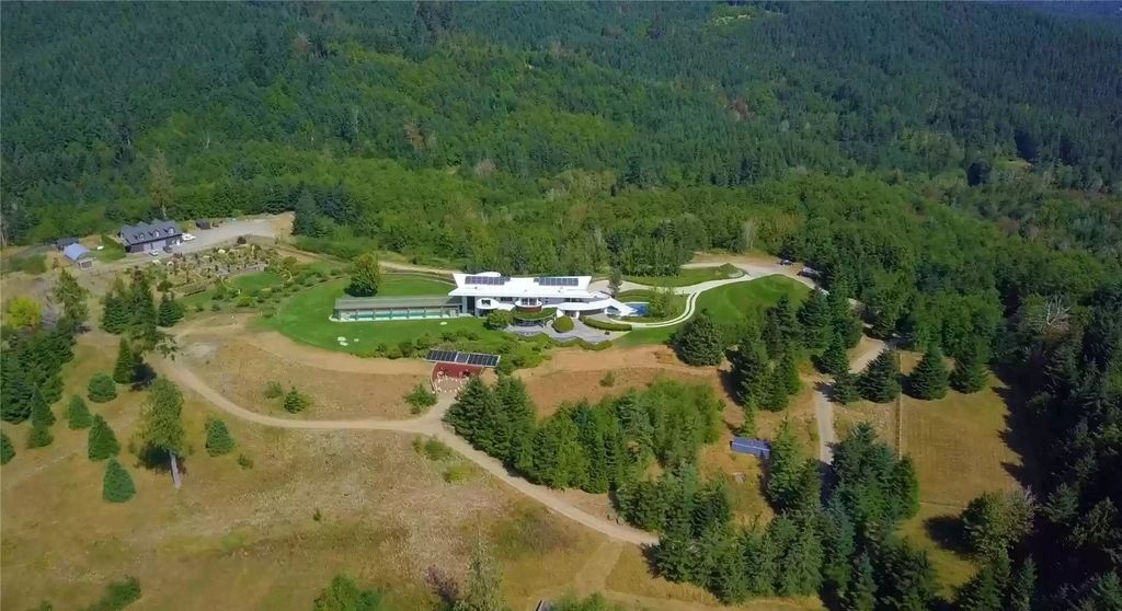 The Home in Tenino  atop 85 acres of stunning land with sustainable gardens, saltwater pool and archery range, now available for sale. This home located at 7415 Nanitch Lane SE, Tenino, Washington