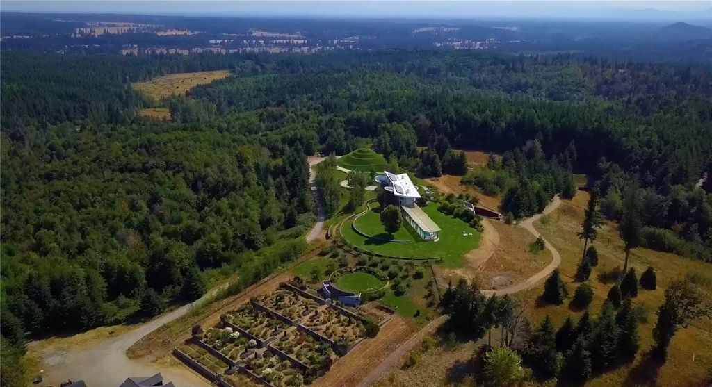 The Home in Tenino  atop 85 acres of stunning land with sustainable gardens, saltwater pool and archery range, now available for sale. This home located at 7415 Nanitch Lane SE, Tenino, Washington