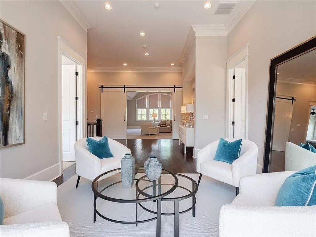 The Estate in Milton is a luxurious home featuring open floor plan and breathtaking outdoor area now available for sale. This home located at 16146 Belford Dr, Milton, Georgia; offering 07 bedrooms and 09 bathrooms with 8,979 square feet of living spaces.