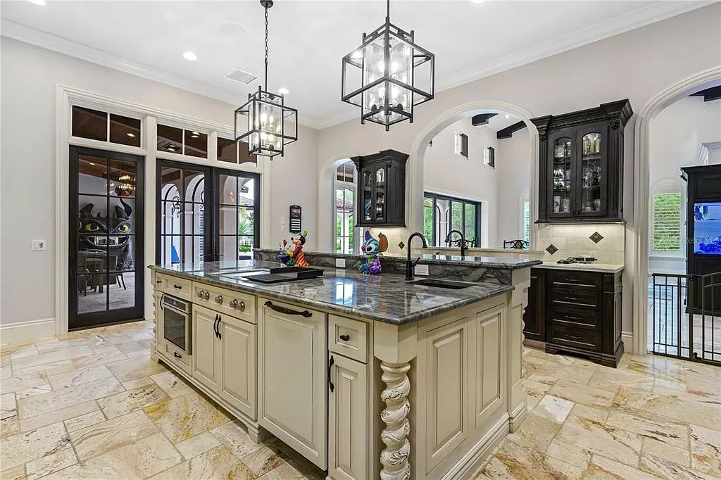 The Estate in Orlando, a one of a kind home in the coveted Carolwood neighborhood in Golden Oak at Walt Disney World Resort offering beautiful outdoor areas with a resort pool and an expansive covered courtyard is now available for sale. This home located at 10151 Enchanted Oak Dr, Orlando, Florida