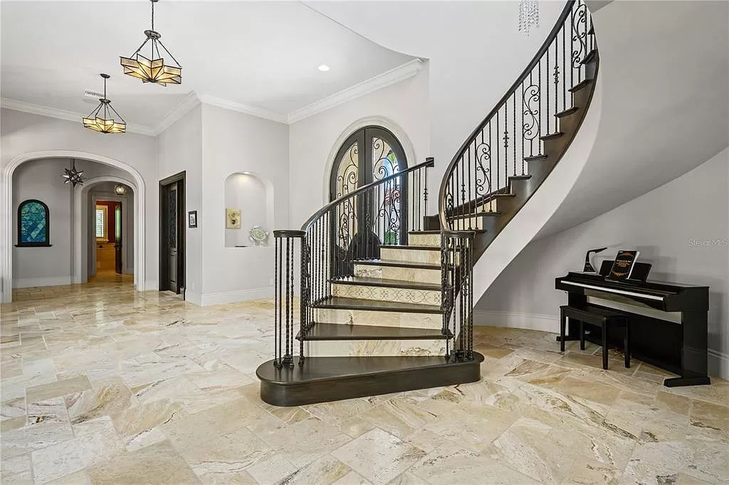 The Estate in Orlando, a one of a kind home in the coveted Carolwood neighborhood in Golden Oak at Walt Disney World Resort offering beautiful outdoor areas with a resort pool and an expansive covered courtyard is now available for sale. This home located at 10151 Enchanted Oak Dr, Orlando, Florida