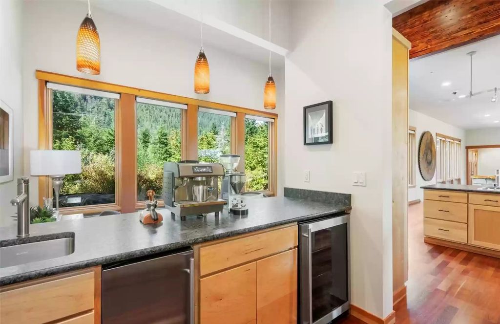 The Estate in North Bend is a luxurious home featuring gorgeous finishes and ideal spaces for a wide choice of entertainment now available for sale. This home located at 16331 Reserve Drive SE, North Bend, Washington; offering 04 bedrooms and 04 bathrooms with 5,710 square feet of living spaces. 