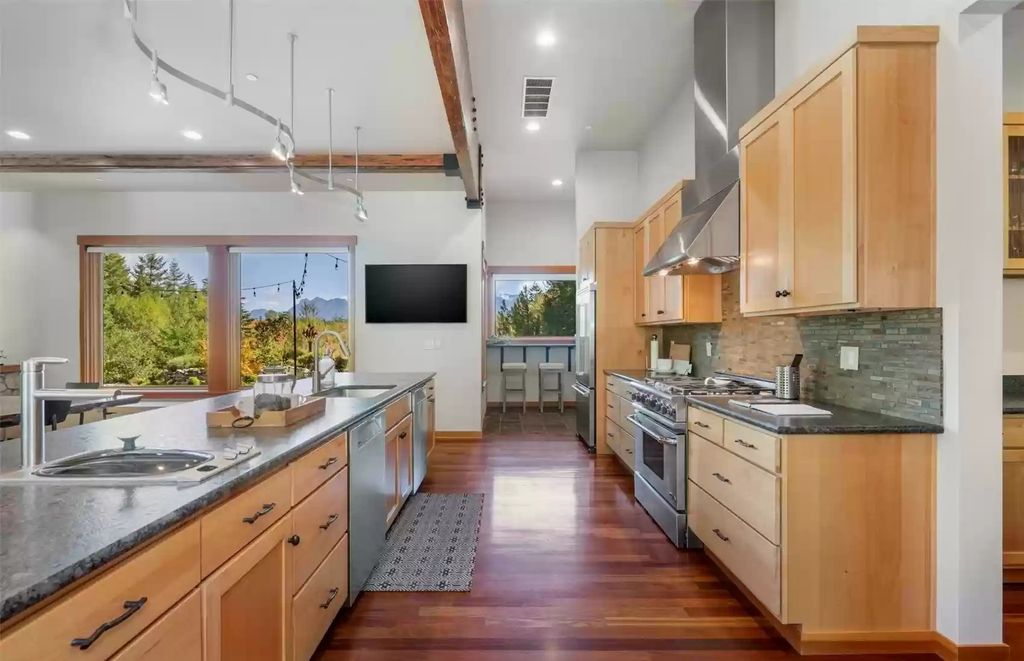 The Estate in North Bend is a luxurious home featuring gorgeous finishes and ideal spaces for a wide choice of entertainment now available for sale. This home located at 16331 Reserve Drive SE, North Bend, Washington; offering 04 bedrooms and 04 bathrooms with 5,710 square feet of living spaces. 