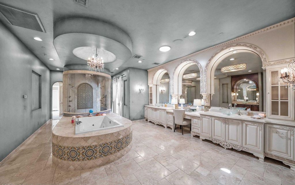 The Estate in Mesa, a an entertainer's dream designed for resort-like living with over 14,000 square feet of pure luxury offering a lush formally landscaped sanctuary and countless amenities is now available for sale. This home located at 1550 N 40th St UNIT 14, Mesa, Arizona