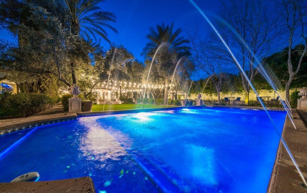 The Estate in Mesa, a an entertainer's dream designed for resort-like living with over 14,000 square feet of pure luxury offering a lush formally landscaped sanctuary and countless amenities is now available for sale. This home located at 1550 N 40th St UNIT 14, Mesa, Arizona