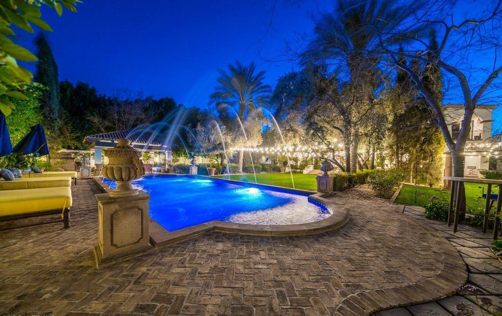 The Estate in Mesa, a an entertainer's dream designed for resort-like living with over 14,000 square feet of pure luxury offering a lush formally landscaped sanctuary and countless amenities is now available for sale. This home located at 1550 N 40th St UNIT 14, Mesa, Arizona