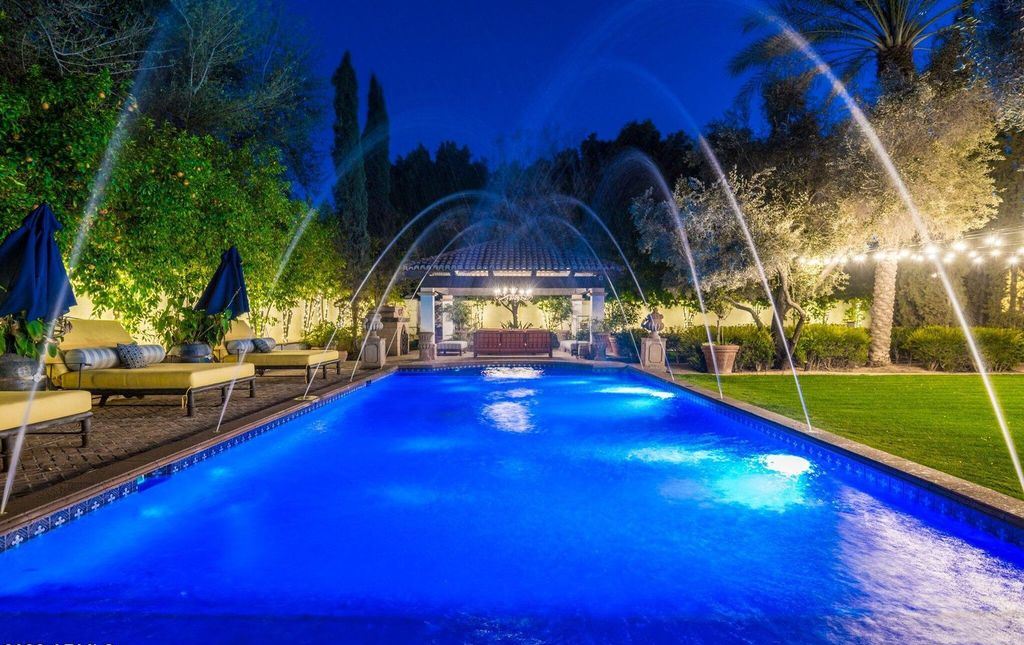 The Estate in Mesa, a an entertainer's dream designed for resort-like living with over 14,000 square feet of pure luxury offering a lush formally landscaped sanctuary and countless amenities is now available for sale. This home located at 1550 N 40th St UNIT 14, Mesa, Arizona