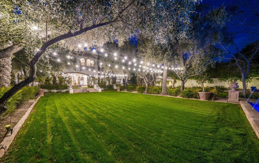 The Estate in Mesa, a an entertainer's dream designed for resort-like living with over 14,000 square feet of pure luxury offering a lush formally landscaped sanctuary and countless amenities is now available for sale. This home located at 1550 N 40th St UNIT 14, Mesa, Arizona