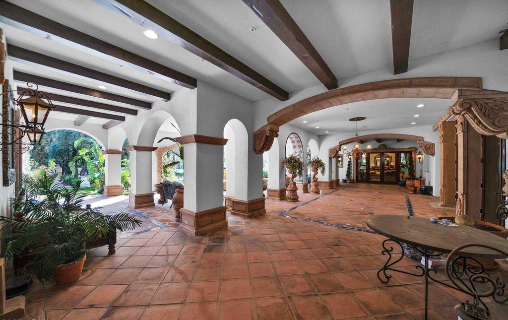 The Estate in Mesa, a an entertainer's dream designed for resort-like living with over 14,000 square feet of pure luxury offering a lush formally landscaped sanctuary and countless amenities is now available for sale. This home located at 1550 N 40th St UNIT 14, Mesa, Arizona