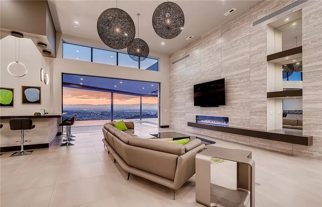 The Home in Henderson, a beautiful estate has a special exclusive view of the famous “Dragon’s Back” in MacDonald Highlands offering a completely comfortable and tranquil atmosphere is now available for sale. This home located at 665 Dragon Peak Dr, Henderson, Nevada