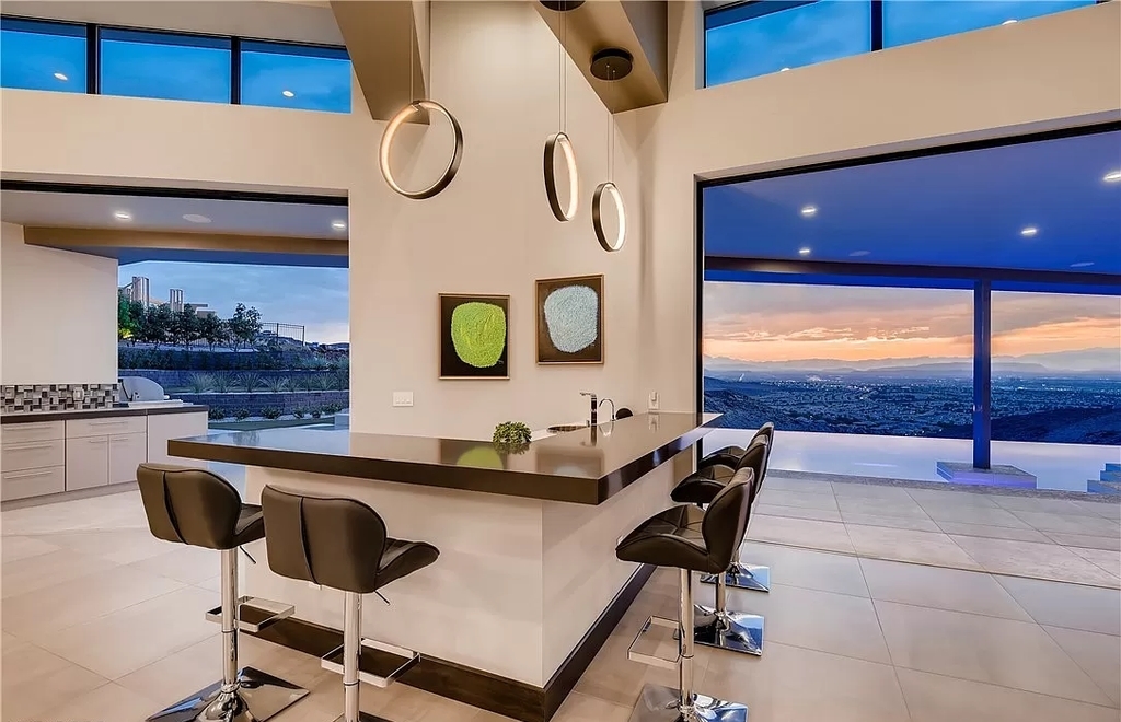 The Home in Henderson, a beautiful estate has a special exclusive view of the famous “Dragon’s Back” in MacDonald Highlands offering a completely comfortable and tranquil atmosphere is now available for sale. This home located at 665 Dragon Peak Dr, Henderson, Nevada
