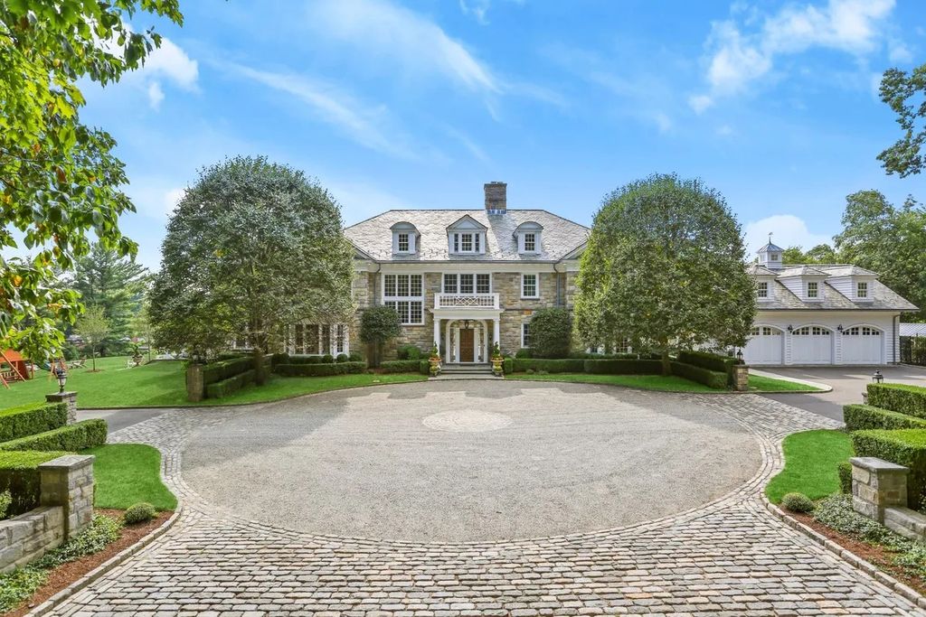 The Manor in Greenwich offers beautiful infinity pool and spa with a pool house, indoor and outdoor showers and outdoor kitchen, now available for sale. This home located at 59 Mooreland Rd, Greenwich, Connecticut