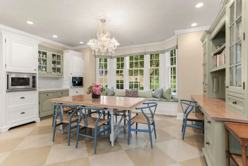 The Manor in Greenwich offers beautiful infinity pool and spa with a pool house, indoor and outdoor showers and outdoor kitchen, now available for sale. This home located at 59 Mooreland Rd, Greenwich, Connecticut