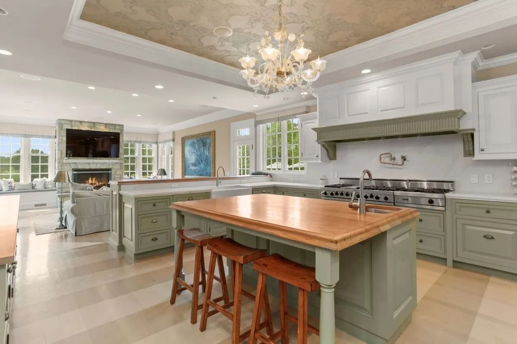 The Manor in Greenwich offers beautiful infinity pool and spa with a pool house, indoor and outdoor showers and outdoor kitchen, now available for sale. This home located at 59 Mooreland Rd, Greenwich, Connecticut