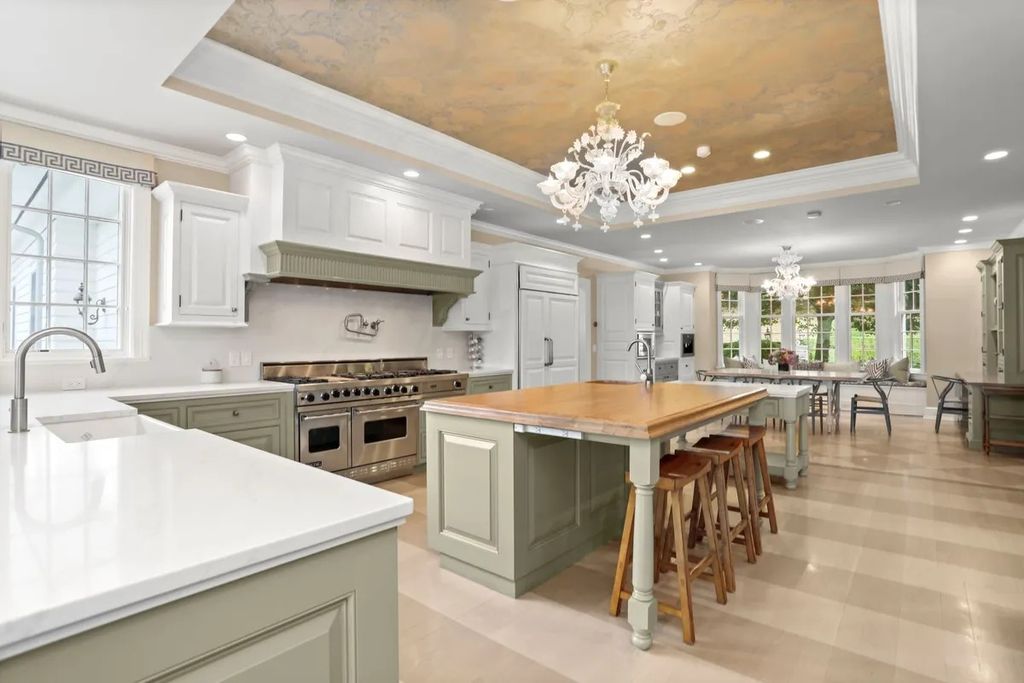 The Manor in Greenwich offers beautiful infinity pool and spa with a pool house, indoor and outdoor showers and outdoor kitchen, now available for sale. This home located at 59 Mooreland Rd, Greenwich, Connecticut