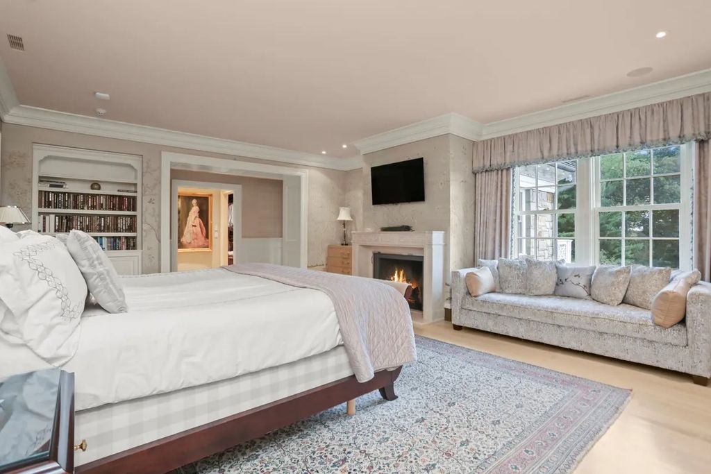 The Manor in Greenwich offers beautiful infinity pool and spa with a pool house, indoor and outdoor showers and outdoor kitchen, now available for sale. This home located at 59 Mooreland Rd, Greenwich, Connecticut