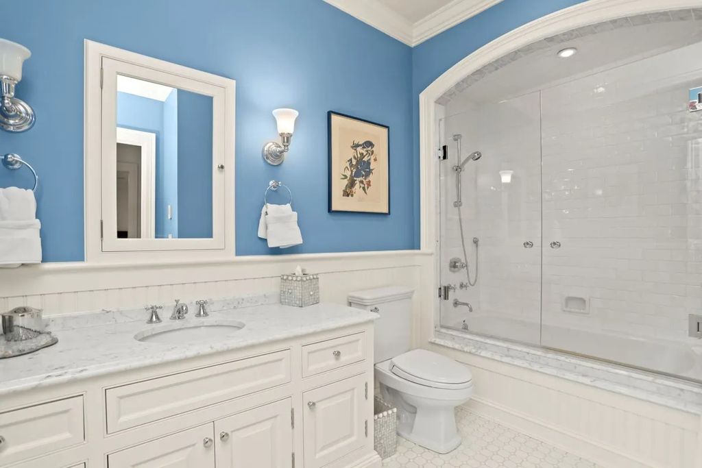 The Manor in Greenwich offers beautiful infinity pool and spa with a pool house, indoor and outdoor showers and outdoor kitchen, now available for sale. This home located at 59 Mooreland Rd, Greenwich, Connecticut