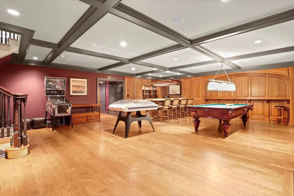 The Manor in Greenwich offers beautiful infinity pool and spa with a pool house, indoor and outdoor showers and outdoor kitchen, now available for sale. This home located at 59 Mooreland Rd, Greenwich, Connecticut