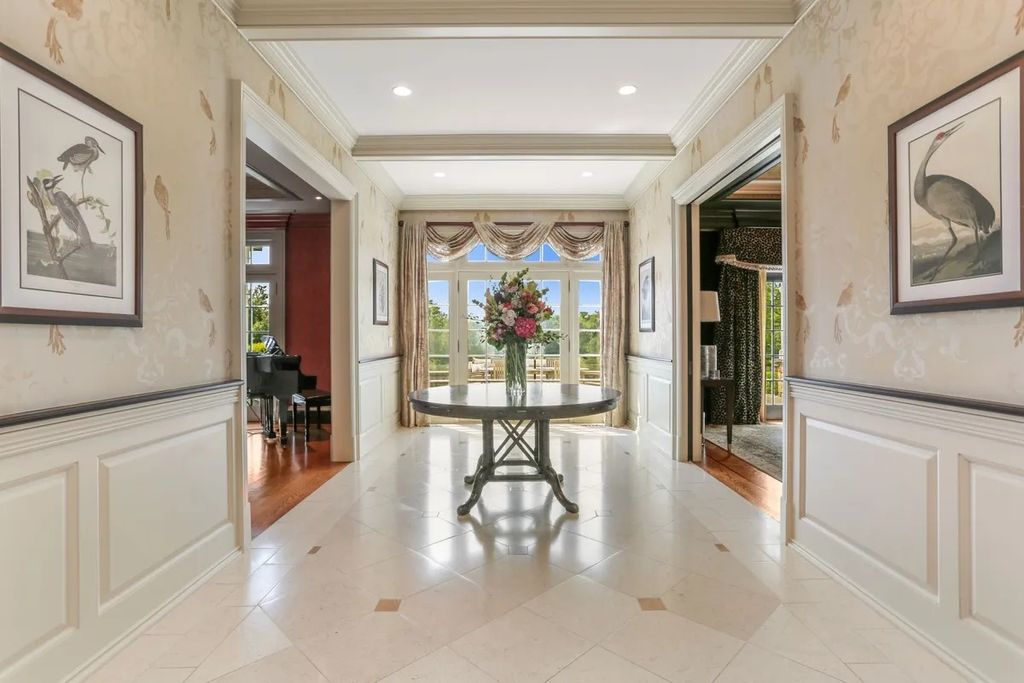 The Manor in Greenwich offers beautiful infinity pool and spa with a pool house, indoor and outdoor showers and outdoor kitchen, now available for sale. This home located at 59 Mooreland Rd, Greenwich, Connecticut