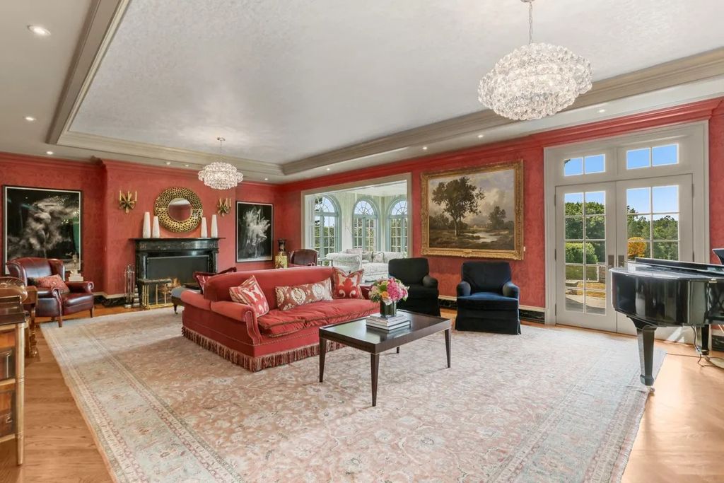 The Manor in Greenwich offers beautiful infinity pool and spa with a pool house, indoor and outdoor showers and outdoor kitchen, now available for sale. This home located at 59 Mooreland Rd, Greenwich, Connecticut
