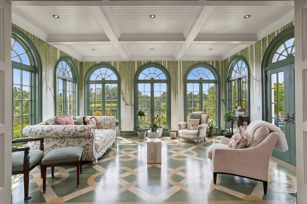 The Manor in Greenwich offers beautiful infinity pool and spa with a pool house, indoor and outdoor showers and outdoor kitchen, now available for sale. This home located at 59 Mooreland Rd, Greenwich, Connecticut