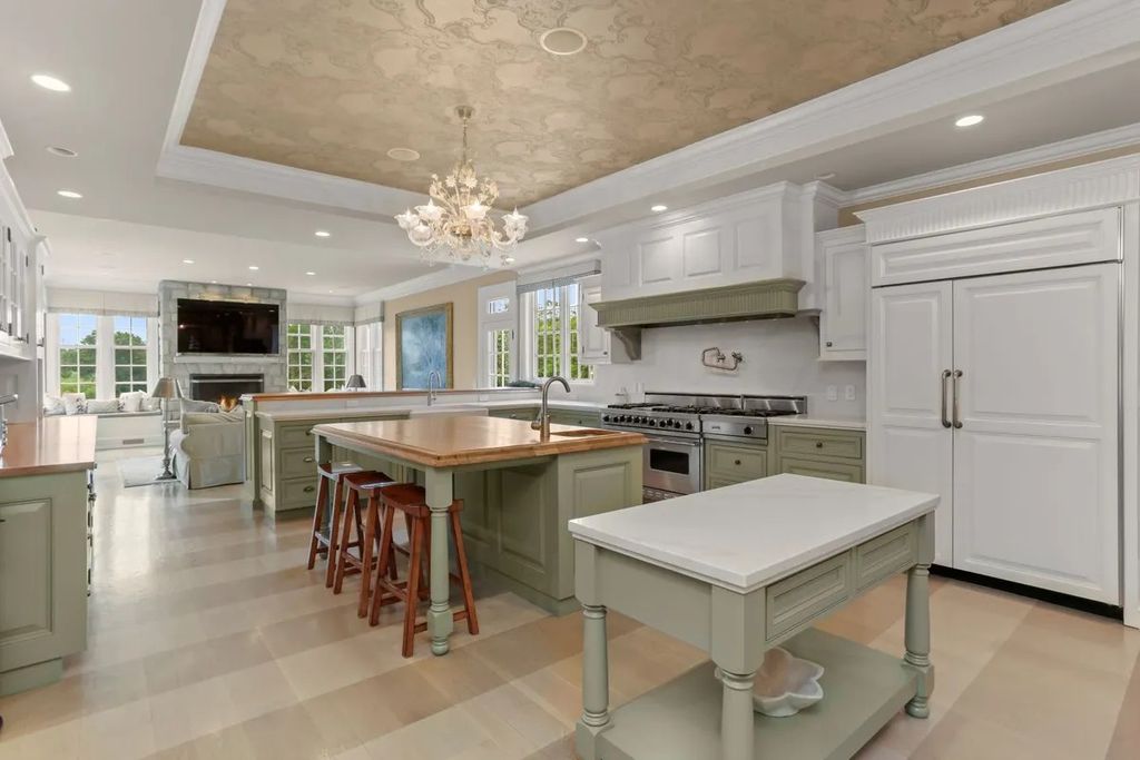 The Manor in Greenwich offers beautiful infinity pool and spa with a pool house, indoor and outdoor showers and outdoor kitchen, now available for sale. This home located at 59 Mooreland Rd, Greenwich, Connecticut