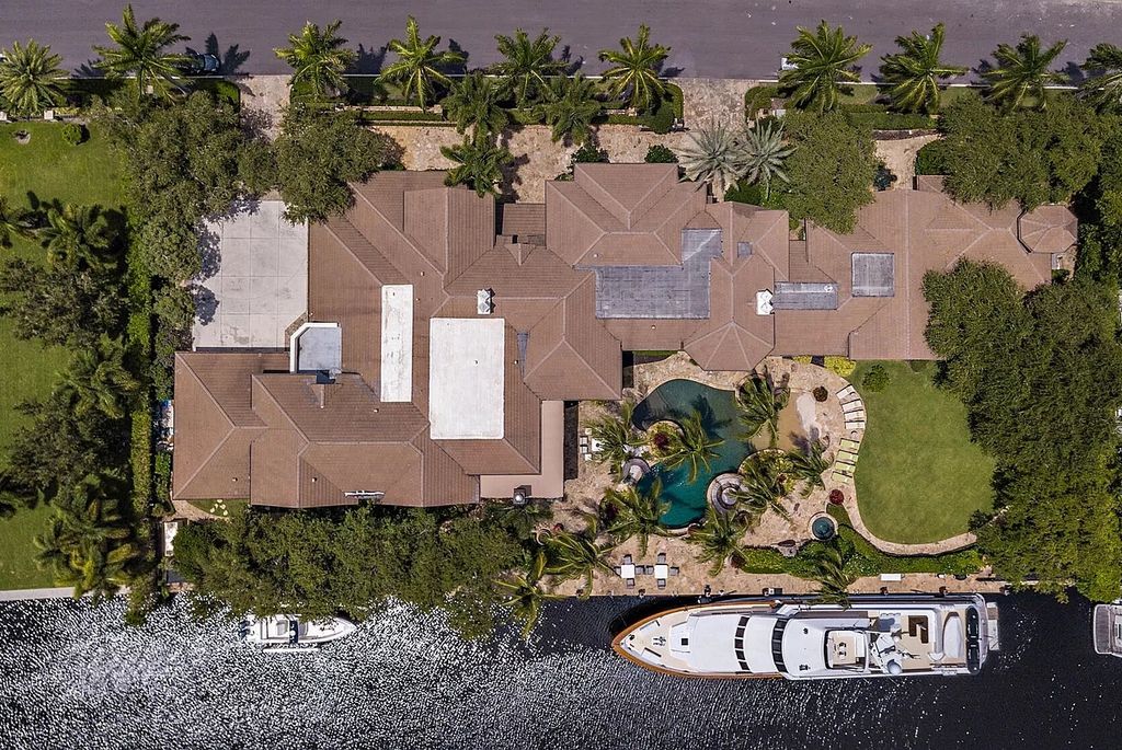 The Mansion in Boca Raton, one of the most celebrated estates in the Royal Palm Yacht & County Club encompasses luxurious living with stunning flagstone terraces, a resort-style pool, and grand entertainment loggia is now available for sale. This home located at 200 W Coconut Palm Rd, Boca Raton, Florida