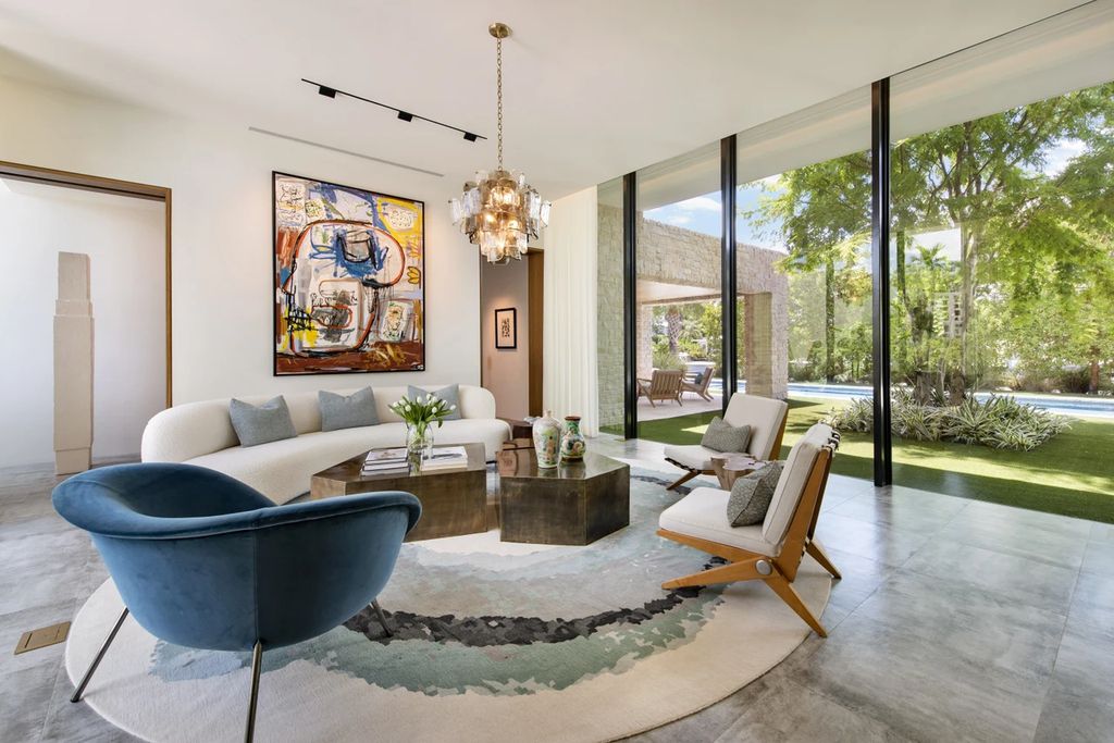 121 Nurmi Dr, Fort Lauderdale, Florida is a sophisticated modernist estate built in 2020 by renown architect Daniel Kahan from Smith and Moore with unbelievable features including beautiful lighting, private gardens, summer kitchen and more.