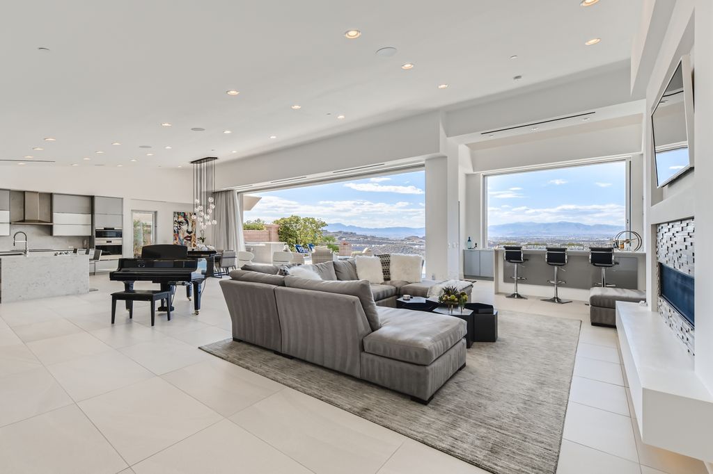 The Home in Henderson, a MacDonald Highlands residence offers a bright and open floor plan, an amazing backyard with infinity edge pool, spa, outdoor kitchen with bbq, fire pit and lounge area is now available for sale. This home located at 667 Palisade Rim Dr, Henderson, Nevada
