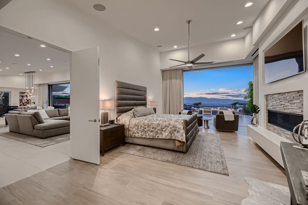 The Home in Henderson, a MacDonald Highlands residence offers a bright and open floor plan, an amazing backyard with infinity edge pool, spa, outdoor kitchen with bbq, fire pit and lounge area is now available for sale. This home located at 667 Palisade Rim Dr, Henderson, Nevada