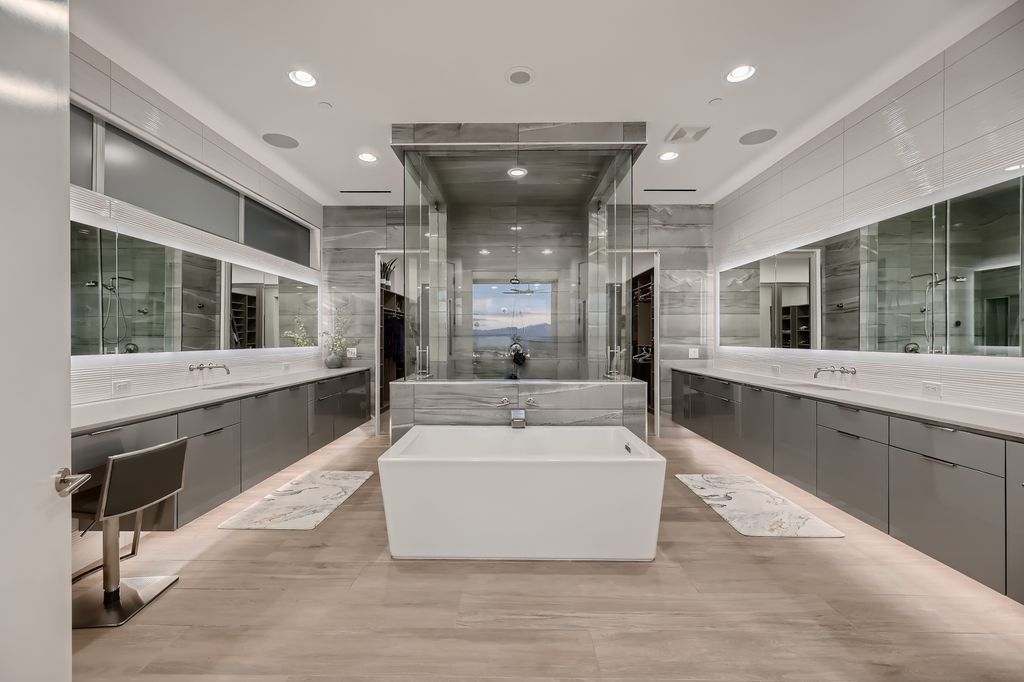 The Home in Henderson, a MacDonald Highlands residence offers a bright and open floor plan, an amazing backyard with infinity edge pool, spa, outdoor kitchen with bbq, fire pit and lounge area is now available for sale. This home located at 667 Palisade Rim Dr, Henderson, Nevada