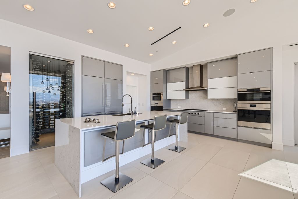 The Home in Henderson, a MacDonald Highlands residence offers a bright and open floor plan, an amazing backyard with infinity edge pool, spa, outdoor kitchen with bbq, fire pit and lounge area is now available for sale. This home located at 667 Palisade Rim Dr, Henderson, Nevada