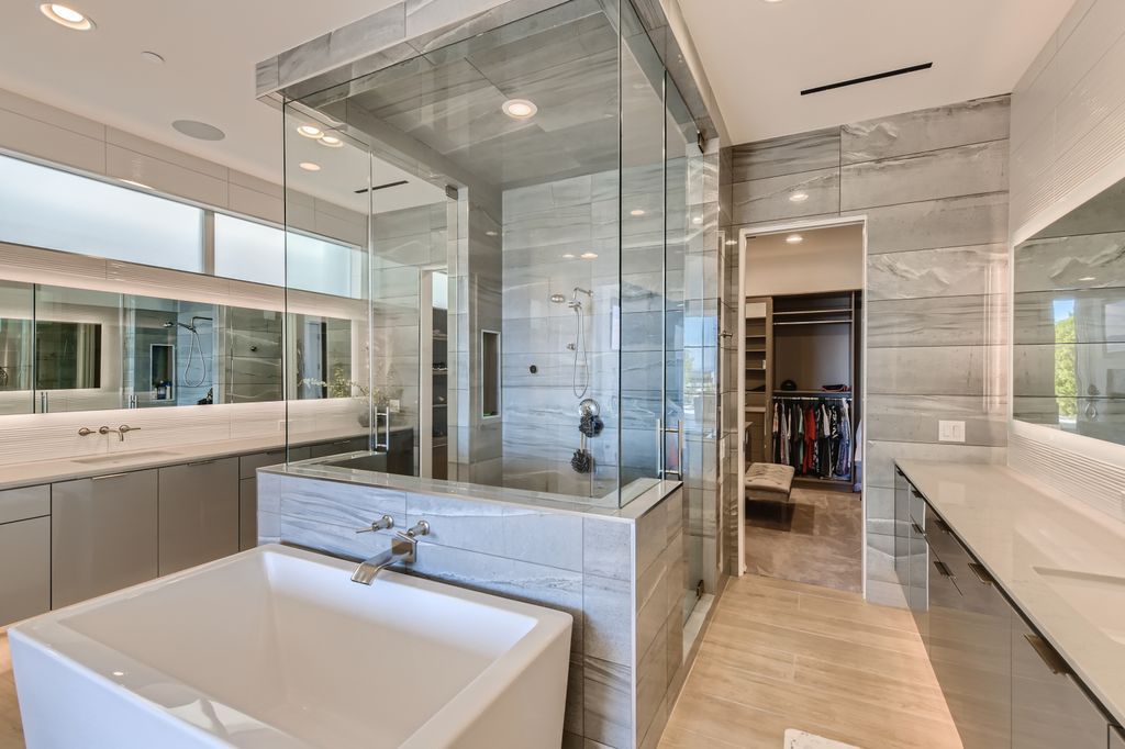 The Home in Henderson, a MacDonald Highlands residence offers a bright and open floor plan, an amazing backyard with infinity edge pool, spa, outdoor kitchen with bbq, fire pit and lounge area is now available for sale. This home located at 667 Palisade Rim Dr, Henderson, Nevada