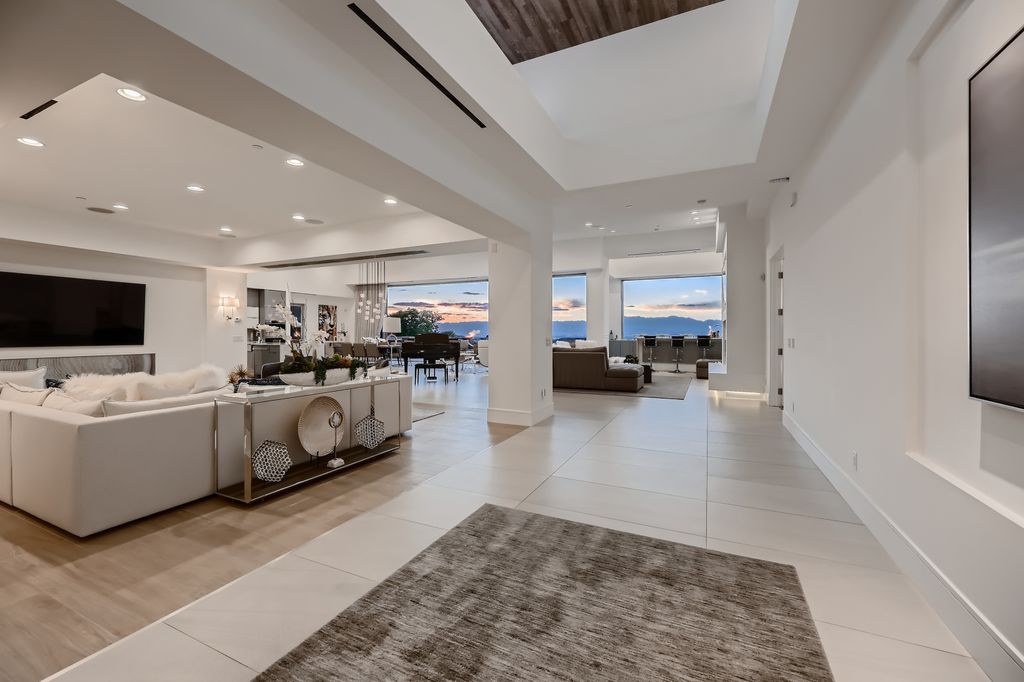 The Home in Henderson, a MacDonald Highlands residence offers a bright and open floor plan, an amazing backyard with infinity edge pool, spa, outdoor kitchen with bbq, fire pit and lounge area is now available for sale. This home located at 667 Palisade Rim Dr, Henderson, Nevada