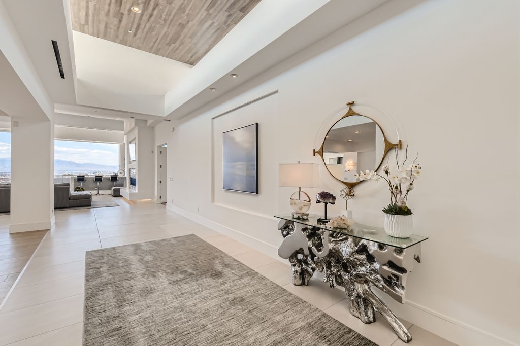The Home in Henderson, a MacDonald Highlands residence offers a bright and open floor plan, an amazing backyard with infinity edge pool, spa, outdoor kitchen with bbq, fire pit and lounge area is now available for sale. This home located at 667 Palisade Rim Dr, Henderson, Nevada