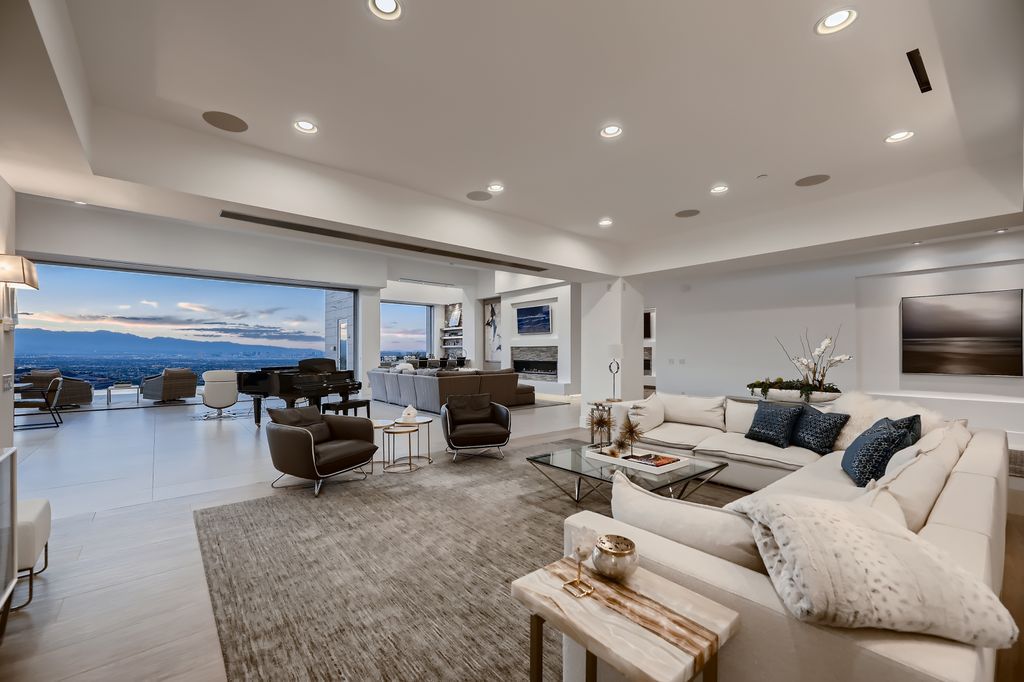 The Home in Henderson, a MacDonald Highlands residence offers a bright and open floor plan, an amazing backyard with infinity edge pool, spa, outdoor kitchen with bbq, fire pit and lounge area is now available for sale. This home located at 667 Palisade Rim Dr, Henderson, Nevada