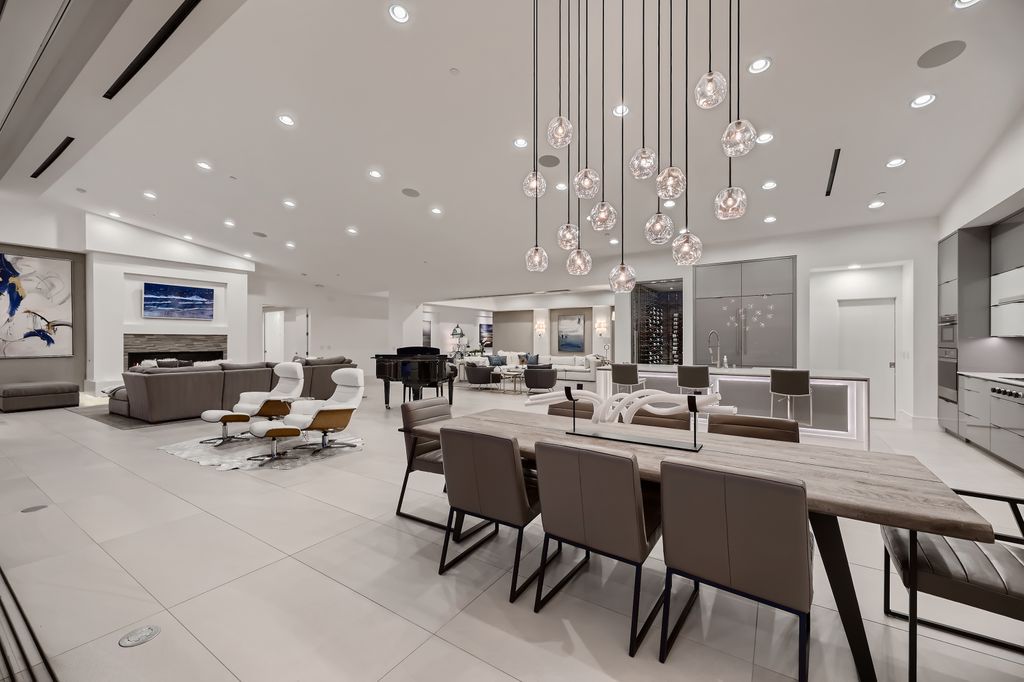The Home in Henderson, a MacDonald Highlands residence offers a bright and open floor plan, an amazing backyard with infinity edge pool, spa, outdoor kitchen with bbq, fire pit and lounge area is now available for sale. This home located at 667 Palisade Rim Dr, Henderson, Nevada